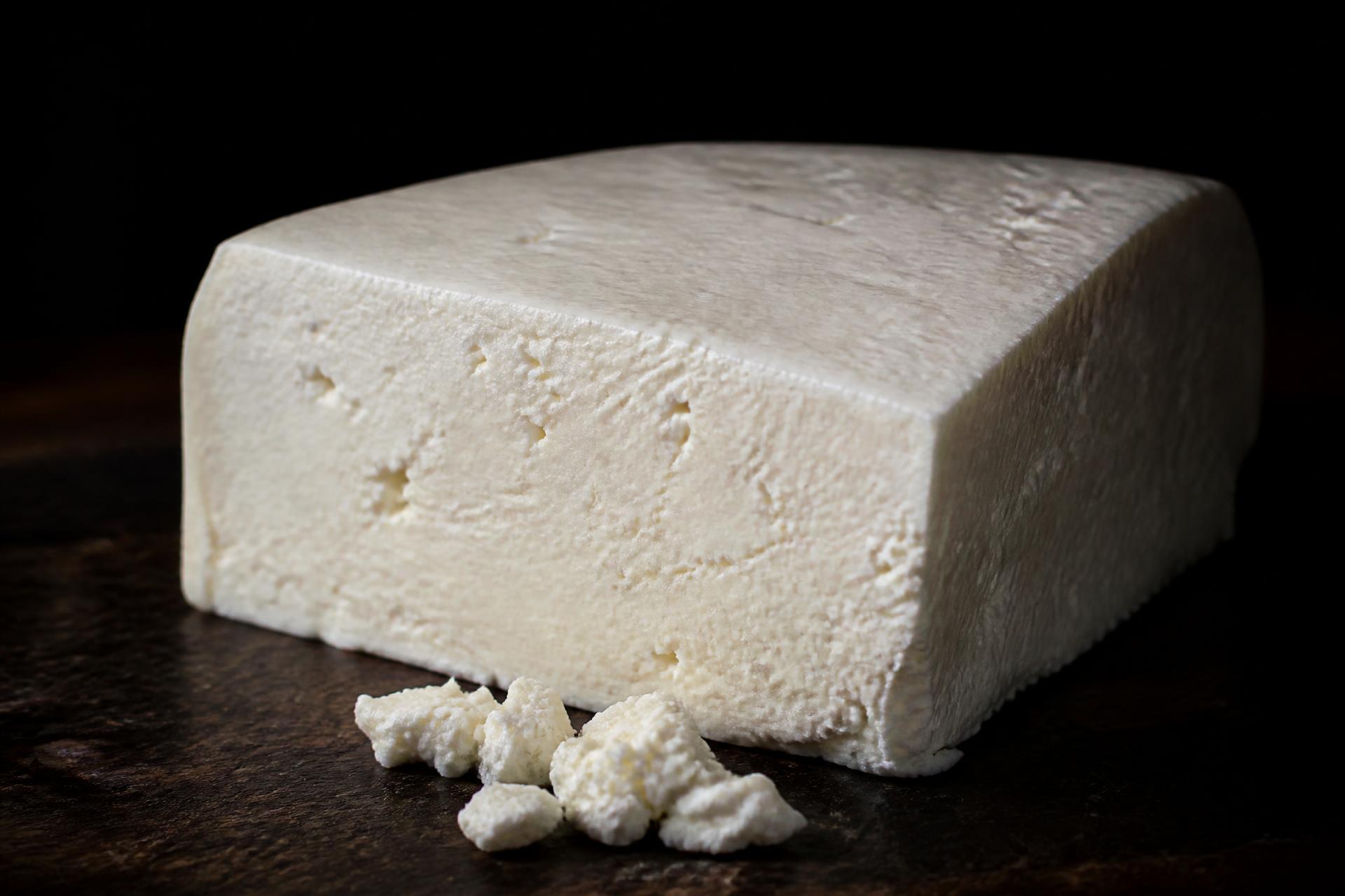 Fresh Venezuelan Llanero cheese on a wooden board